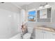 Clean bathroom with a shower/tub combo and white vanity at 445 Horseshoe Loop Rd, Terra Ceia, FL 34250