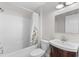 Updated bathroom with a tub and dark vanity at 445 Horseshoe Loop Rd, Terra Ceia, FL 34250