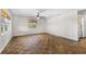 Spacious bedroom with hardwood floors and ceiling fan at 445 Horseshoe Loop Rd, Terra Ceia, FL 34250