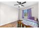 Cozy bedroom with a twin bed and ceiling fan at 445 Horseshoe Loop Rd, Terra Ceia, FL 34250