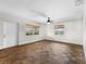 Large bedroom with hardwood floors and neutral decor at 445 Horseshoe Loop Rd, Terra Ceia, FL 34250