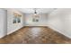 Bright bedroom with hardwood floors and large windows at 445 Horseshoe Loop Rd, Terra Ceia, FL 34250