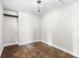 Well-lit bedroom with wood floors and a closet at 445 Horseshoe Loop Rd, Terra Ceia, FL 34250