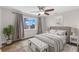 Spacious bedroom with a large bed, window, and hardwood floors at 445 Horseshoe Loop Rd, Terra Ceia, FL 34250