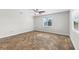 Bright bedroom with wood-look floors and a window at 445 Horseshoe Loop Rd, Terra Ceia, FL 34250