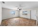 Spacious bonus room with wood-look floors and two windows at 445 Horseshoe Loop Rd, Terra Ceia, FL 34250