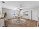 Bright dining room with a round table and hardwood floors at 445 Horseshoe Loop Rd, Terra Ceia, FL 34250