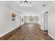 Large living area with hardwood floors and neutral walls at 445 Horseshoe Loop Rd, Terra Ceia, FL 34250