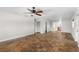 Bright living room with hardwood floors and views into kitchen at 445 Horseshoe Loop Rd, Terra Ceia, FL 34250