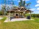 Open-air picnic pavilion with tables and benches, perfect for outdoor gatherings at 445 Horseshoe Loop Rd, Terra Ceia, FL 34250
