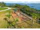 playground with swings and slides, overlooking the bay at 445 Horseshoe Loop Rd, Terra Ceia, FL 34250