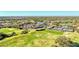Aerial view of community, including golf course and clubhouse at 4655 Tower Hill Ln # 2412, Sarasota, FL 34238