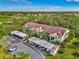 Aerial view of condo building with surrounding landscape at 4655 Tower Hill Ln # 2412, Sarasota, FL 34238