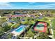 Community pool, tennis courts, and lush landscaping in this luxurious community at 4655 Tower Hill Ln # 2412, Sarasota, FL 34238