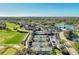 Aerial view of community tennis courts, pool, and golf course at 4655 Tower Hill Ln # 2412, Sarasota, FL 34238