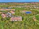 Aerial view of condo building nestled in a green landscape at 4655 Tower Hill Ln # 2412, Sarasota, FL 34238