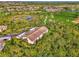 Aerial view showcasing building and surrounding golf course at 4655 Tower Hill Ln # 2412, Sarasota, FL 34238