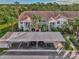 Aerial view of condo building showcasing the building and parking at 4655 Tower Hill Ln # 2412, Sarasota, FL 34238