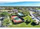 Tennis court and swimming pool in a sunny community setting at 4655 Tower Hill Ln # 2412, Sarasota, FL 34238