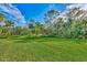 Spacious grassy backyard, ideal for outdoor enjoyment at 4655 Tower Hill Ln # 2412, Sarasota, FL 34238
