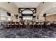 Community clubhouse bar with seating for residents at 4655 Tower Hill Ln # 2412, Sarasota, FL 34238