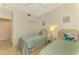 Guest bedroom with twin beds and nightstand at 4655 Tower Hill Ln # 2412, Sarasota, FL 34238