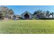 Community clubhouse with manicured lawn at 4655 Tower Hill Ln # 2412, Sarasota, FL 34238