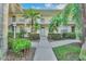 Condo building exterior with landscaping and walkway at 4655 Tower Hill Ln # 2412, Sarasota, FL 34238