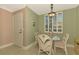 Cozy dining area with a glass-top table and wicker chairs, near entryway at 4655 Tower Hill Ln # 2412, Sarasota, FL 34238