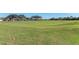 Rolling greens and fairways of the golf course at 4655 Tower Hill Ln # 2412, Sarasota, FL 34238