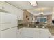 Kitchen with granite countertops, white cabinets, and stainless steel appliances at 4655 Tower Hill Ln # 2412, Sarasota, FL 34238