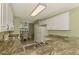 Well-equipped kitchen with granite countertops and white cabinets at 4655 Tower Hill Ln # 2412, Sarasota, FL 34238