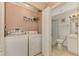 Laundry room with washer, dryer, and additional storage at 4655 Tower Hill Ln # 2412, Sarasota, FL 34238