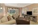 Living room with patio access and a recliner at 4655 Tower Hill Ln # 2412, Sarasota, FL 34238