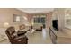 Living room with sectional sofa and TV stand at 4655 Tower Hill Ln # 2412, Sarasota, FL 34238