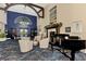 Elegant community clubhouse lobby with fireplace and piano at 4655 Tower Hill Ln # 2412, Sarasota, FL 34238