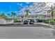 Condo building with covered parking and landscaping at 4655 Tower Hill Ln # 2412, Sarasota, FL 34238