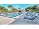 Community pool with lounge chairs, ideal for relaxation at 4655 Tower Hill Ln # 2412, Sarasota, FL 34238