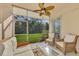 Bright sunroom with wicker furniture and screened lanai at 4655 Tower Hill Ln # 2412, Sarasota, FL 34238