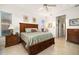 Main bedroom with king-size bed and ample natural light at 4964 Bella Terra Dr, Venice, FL 34293