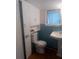 Clean bathroom with light blue tile and built-in storage at 5 Palm Ave, Bradenton, FL 34208
