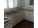 Bright kitchen featuring ample cabinetry and a double sink at 5 Palm Ave, Bradenton, FL 34208