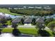 Aerial view of a villa community near a golf course and water at 5156 Mahogany Run Ave, Sarasota, FL 34241