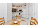 View of kitchen with breakfast nook and white cabinetry at 5156 Mahogany Run Ave, Sarasota, FL 34241