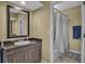 Guest bathroom with dark brown vanity and a shower/tub combo at 528 Forest Way, Longboat Key, FL 34228