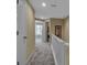 Hallway with carpeted floor and doors to rooms at 528 Forest Way, Longboat Key, FL 34228