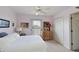 Bright bedroom with queen bed and ceiling fan at 5524 River Sound Ter, Bradenton, FL 34208