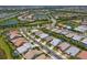 Aerial view of houses with pools in a residential neighborhood at 5716 Bay Pine Way, Sarasota, FL 34238