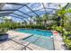 Large, screened pool with spa and water features at 5716 Bay Pine Way, Sarasota, FL 34238