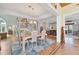 Bright dining room with hardwood floors and a beautiful chandelier at 585 Gunwale Ln, Longboat Key, FL 34228